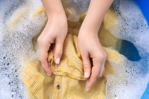 istock Woman washing garment in suds, closeup. Laundry 1451005582
