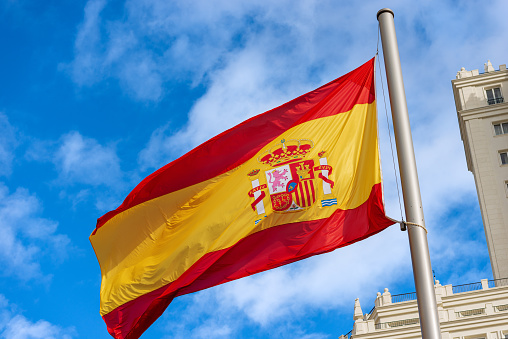 Bandera española que sopla en el viento - Plaza de España Madrid España photo