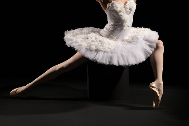 istock Classical ballet artist posing on a black background 1451007245