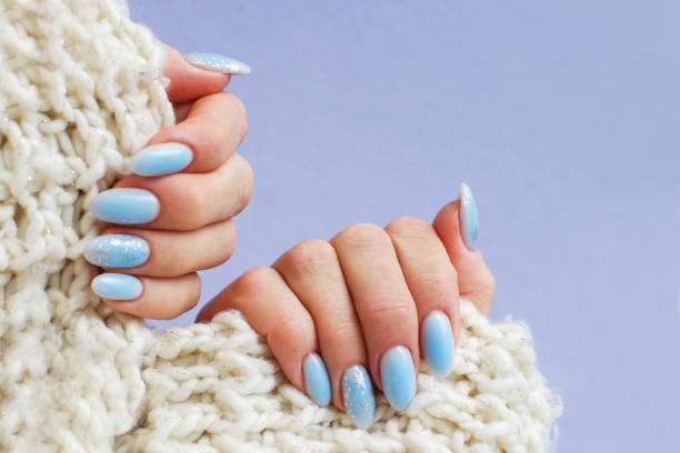 istock Cozy nails with winter manicure with snowflakes 1451013113