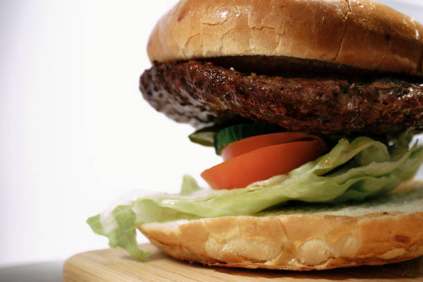 Beef burger in a brioche bun with salad.