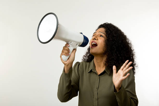 istock Woman screaming into megaphone 1451023524