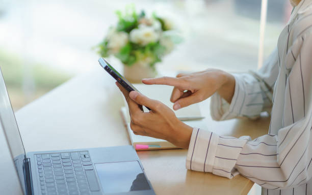 istock Woman using smartphone to send text , work or play social media. 1451029993