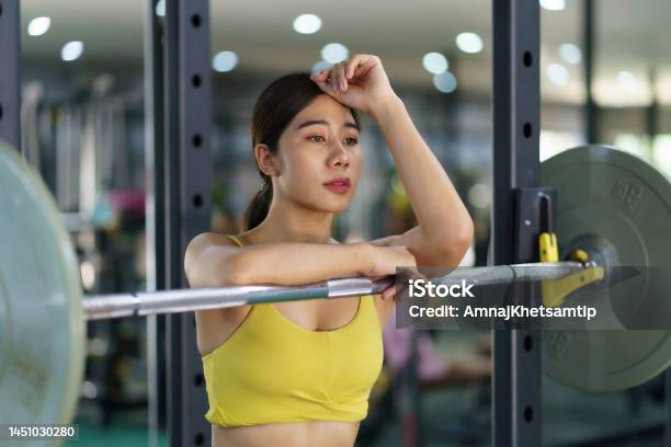 Asian Chinese Female Barbell Workout Exercise At Gym Stock Photo