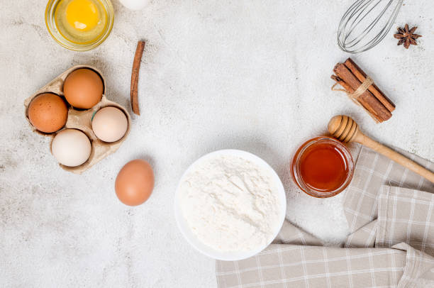 istock Ingredients for making dough dishes: cakes, cookies, muffins, pies on a gray background. 1451031966
