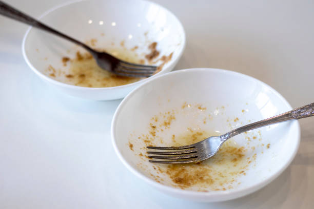istock Dirty dishes, selective focus. Two white bowls and forks. 1451032248