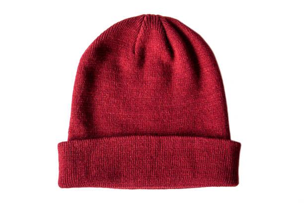 istock Warm knitted red wool hat on insulated white background, top view 1451033122