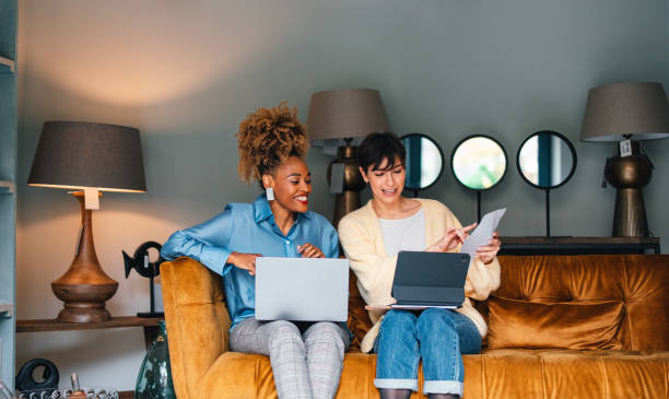 istock Two Smiling Colleagues Working Together In A Home Decor Store 1451035065