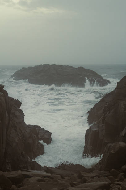 istock Steep cliffs and stormy sea landscape photo 1451035611