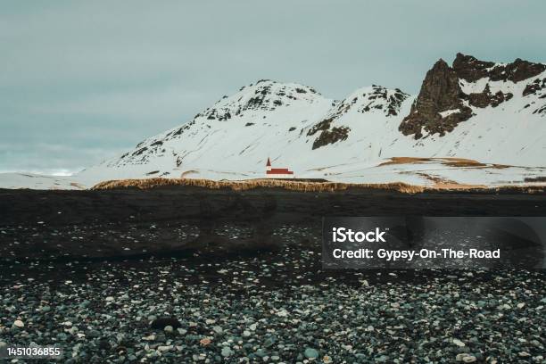 Reyniskirkja Church Near Mountain Landscape Photo Stock Photo - Download Image Now - Architecture, Awe, Backgrounds