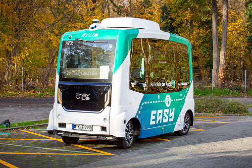 Frankfurt, Germany - November 21, 2022: Driverless transport system on the road in Frankfurt-Riederwald, Germany. The autonomous minibuses with the designation \