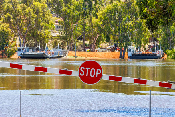 istock Stop barrier for Mannum river ferries moored at levee with flooding River Murray 1451041299