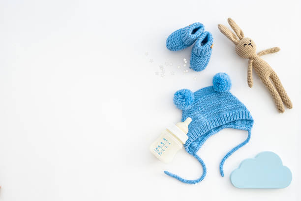 istock Baby boy blue hat with booties and accessories, top view 1451047802