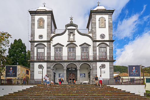 Funchal, Portugal - November 21, 2022: People on the steps of Nossa Senhora da Monte church in Funchal.