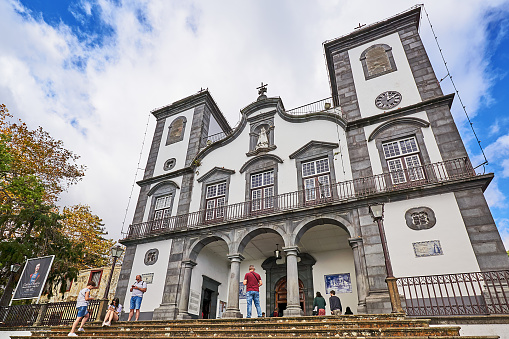 Funchal, Portugal - November 21, 2022: People on the steps of Nossa Senhora da Monte church in Funchal.