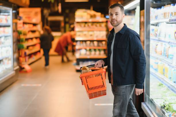 istock Man shopping in a supermarket 1451048468