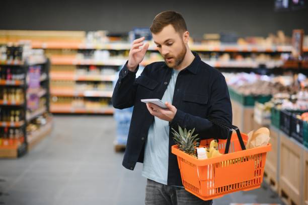 istock man in supermarket, grocery store customer 1451048491