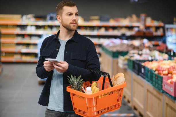 istock Man shopping in a supermarket 1451049028