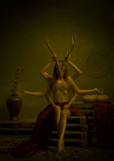istock Asian Halloween model with multiple hands wearing deer skull 1451049228