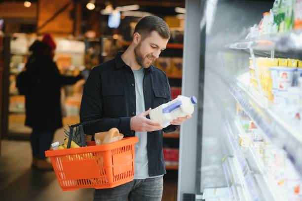 istock man in supermarket, grocery store customer 1451050023