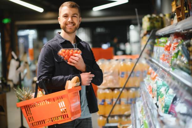 istock man in supermarket, grocery store customer 1451050103