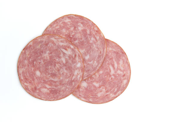 istock ham cut into pieces isolated on white background 1451055600