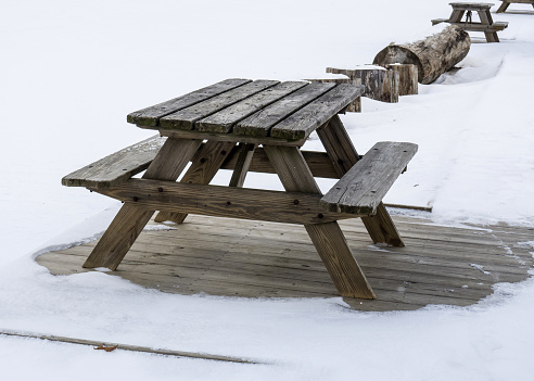 Old wooden bench in winter