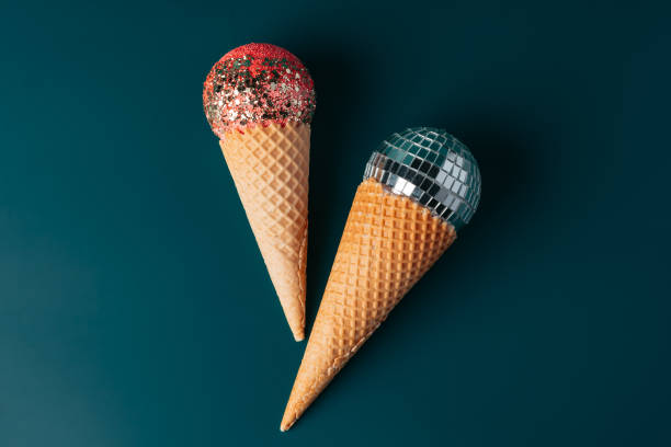 istock Christmas fun decorative fake ice cream cone on dark green background 1451059567