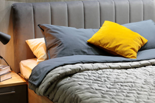 istock pillows, cushions and blankets on a bed in bedroom 1451062314