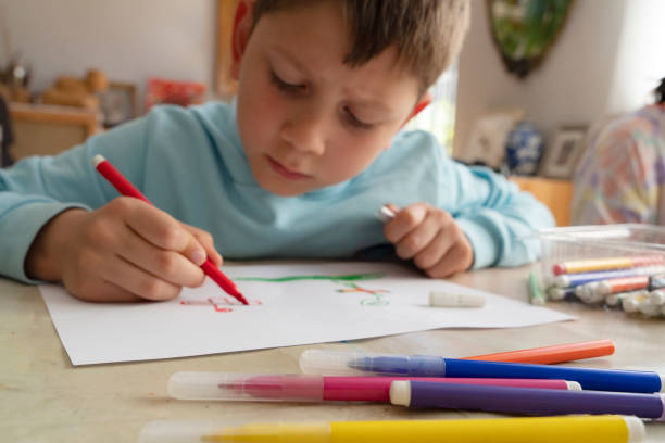 istock Little boy painting 1451064887