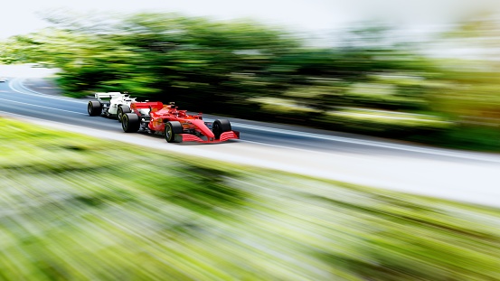 red race car leading on a race track