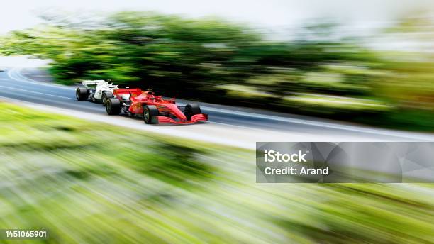 Red Race Car Leading On A Race Track Stock Photo - Download Image Now - Sports Track, Racecar, Car