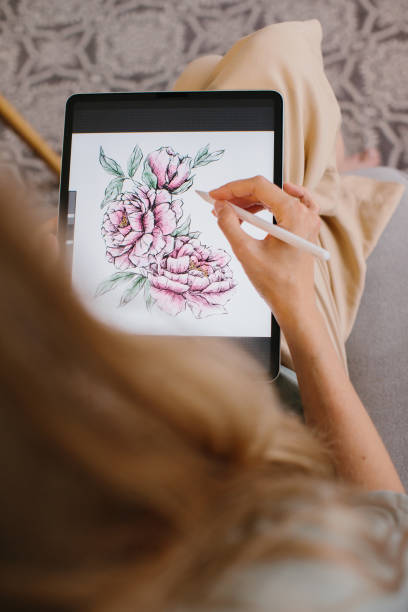 istock Artist or designer making new project, drawing on a graphic tablet with pencil, close-up on a screen. 1451068098