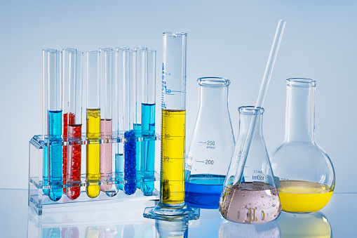 Laboratory Research concept. Scientific laboratory glassware with colourful liquid.