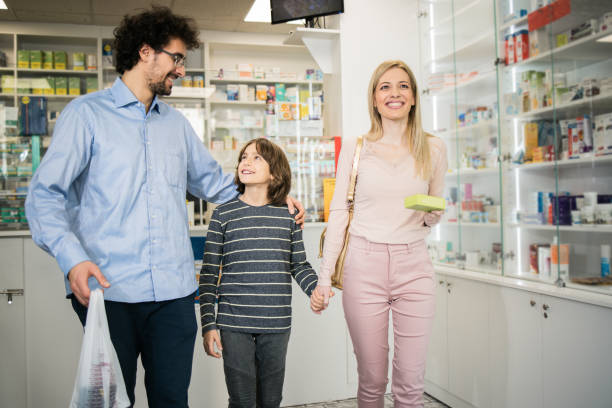 istock Happy young family bought something at the pharmacy 1451072168