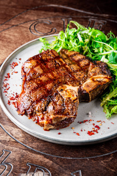 istock Porterhouse beef steak cooked on a grill on plate 1451072206