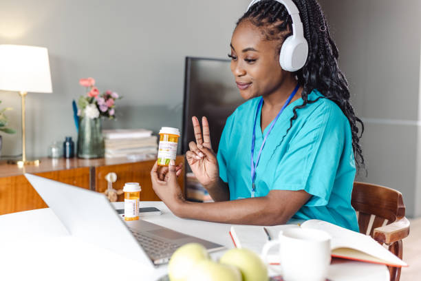 istock Young female doctor having a video call with a patient 1451072396