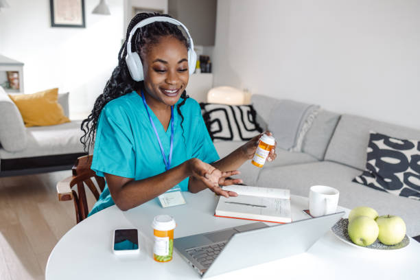 istock Young female doctor working from home 1451072442