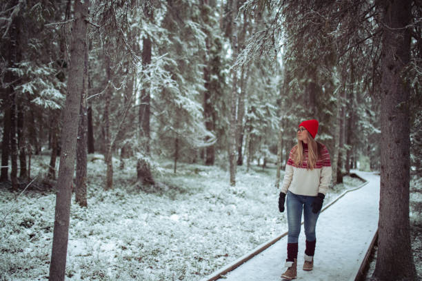 istock A beautiful woman walks along a path through the forest 1451072954