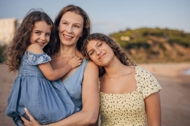 istock Mom and daughters on vacation 1451074063