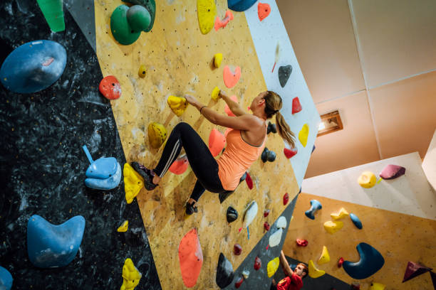 istock Sportswoman training climbing on indoor climbing wall 1451074518