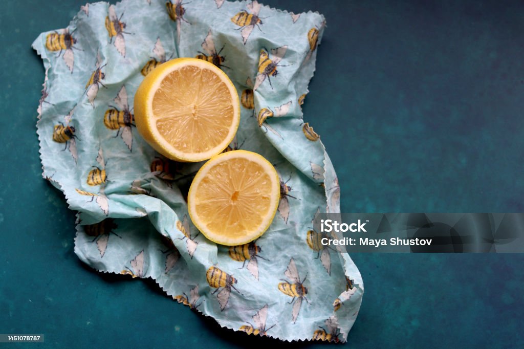 Beeswax wrap Lemon on beeswax food wrap. Reusable sustainable wrap. Environment friendly alternative of plastic. Adult Stock Photo