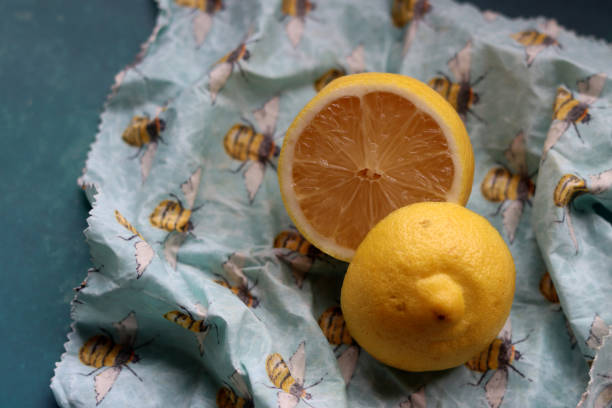 Beeswax wrap Lemon on beeswax food wrap. Reusable sustainable wrap. Environment friendly alternative of plastic. beeswax wrap stock pictures, royalty-free photos & images