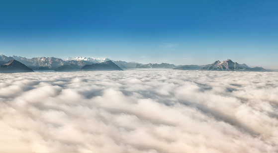 Mount Pilatus rises from a sea of fog over Lake Lucerne in Central Switzerland