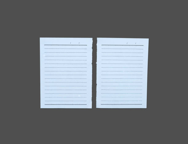 istock White ripped note, notebook paper stuck with sticky tape on black background. 1451081788