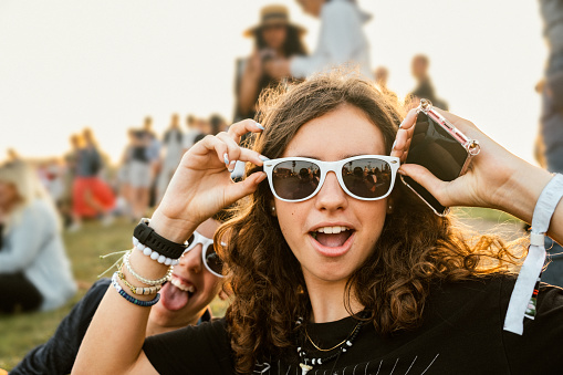 Teenagers goofing around at summer music festival