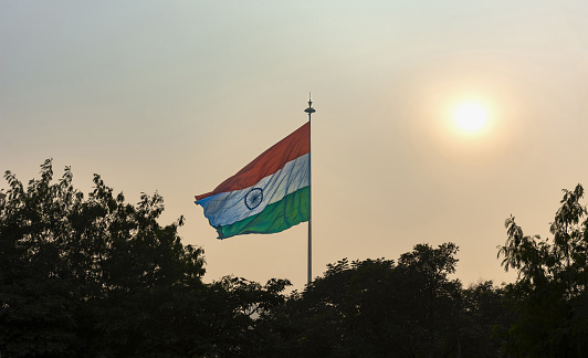 New Delhi, India, December 10, 2015: View of the huge Indian flag above the Connaught Place on an afternoon with heavy smog.