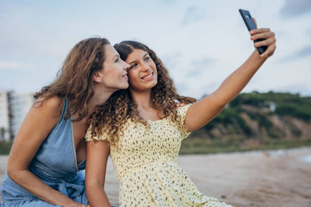 Free Stock Photo of Mother and daughter selfie with a happy smile