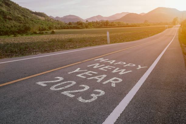 istock The words Happy New Year 2023 written on an empty road. 1451090449