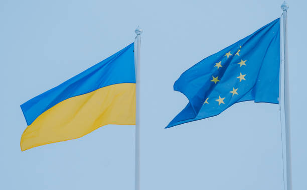 istock Ukrainian and EU Flag Close up 1451093772